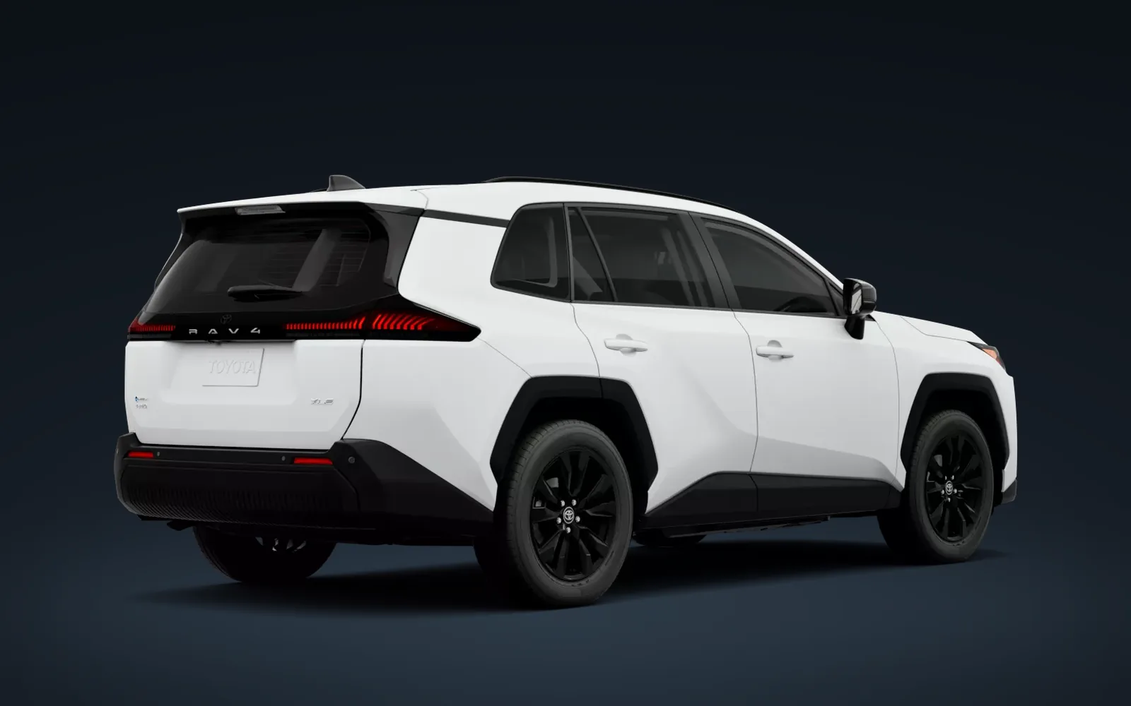 Toyota RAV4 XLE Premium 2026 blanca, vista trasera en estudio