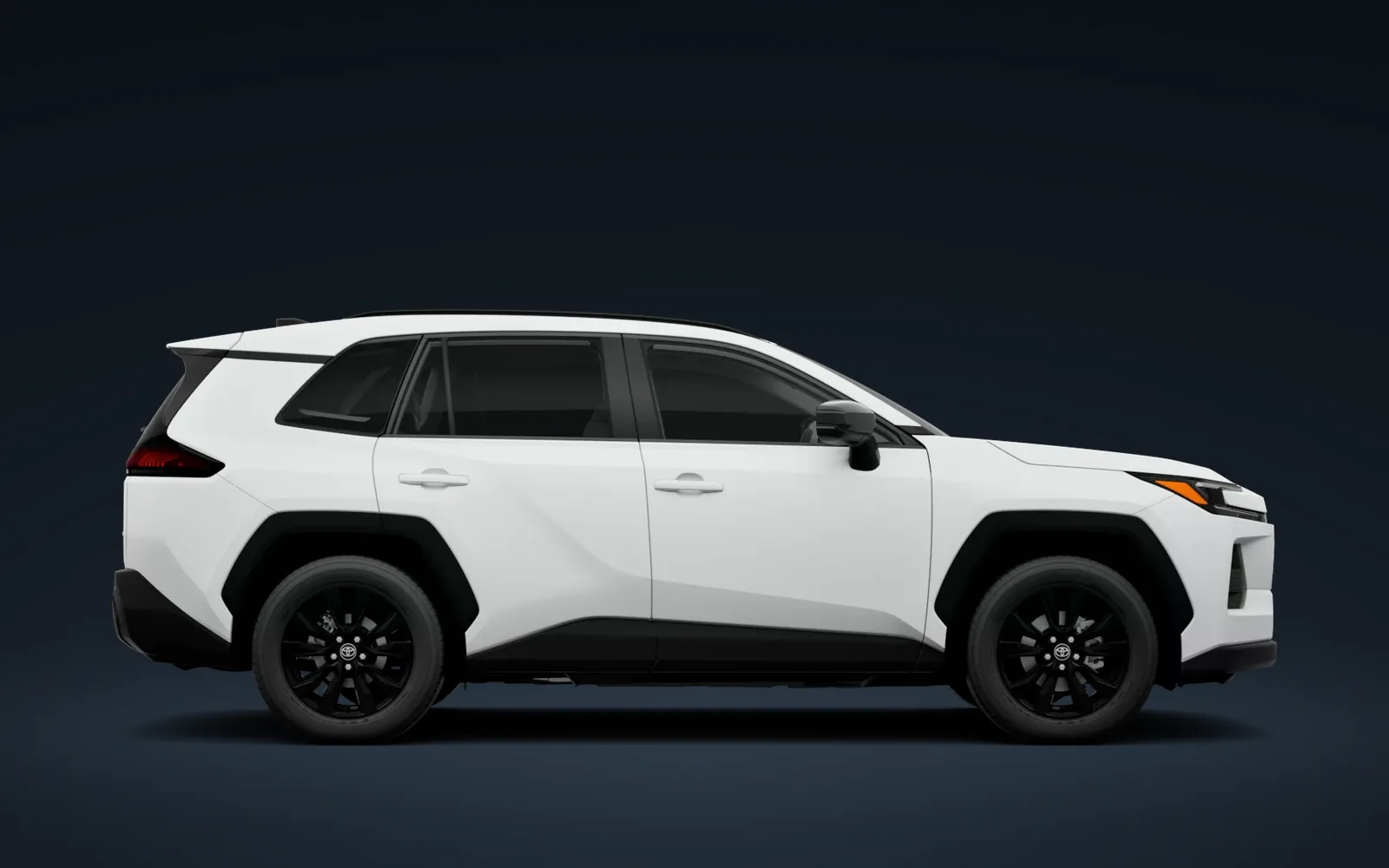 Perfil lateral de la RAV4 XLE Premium 2026 blanca en estudio