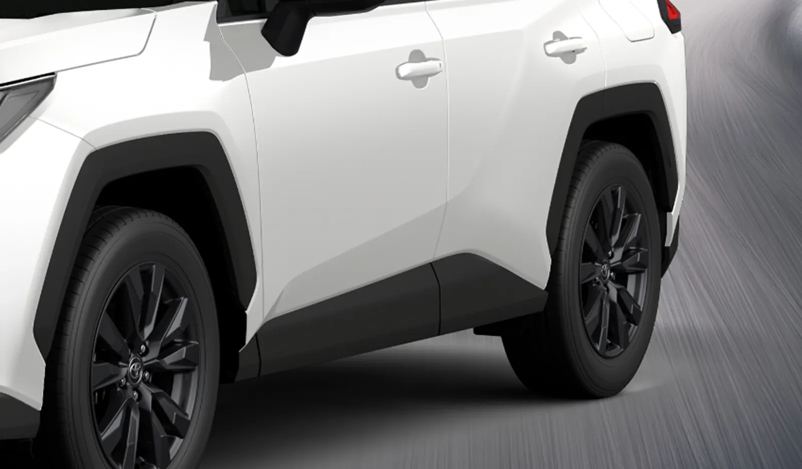 Detalle lateral y rin trasero de la RAV4 2026 blanca